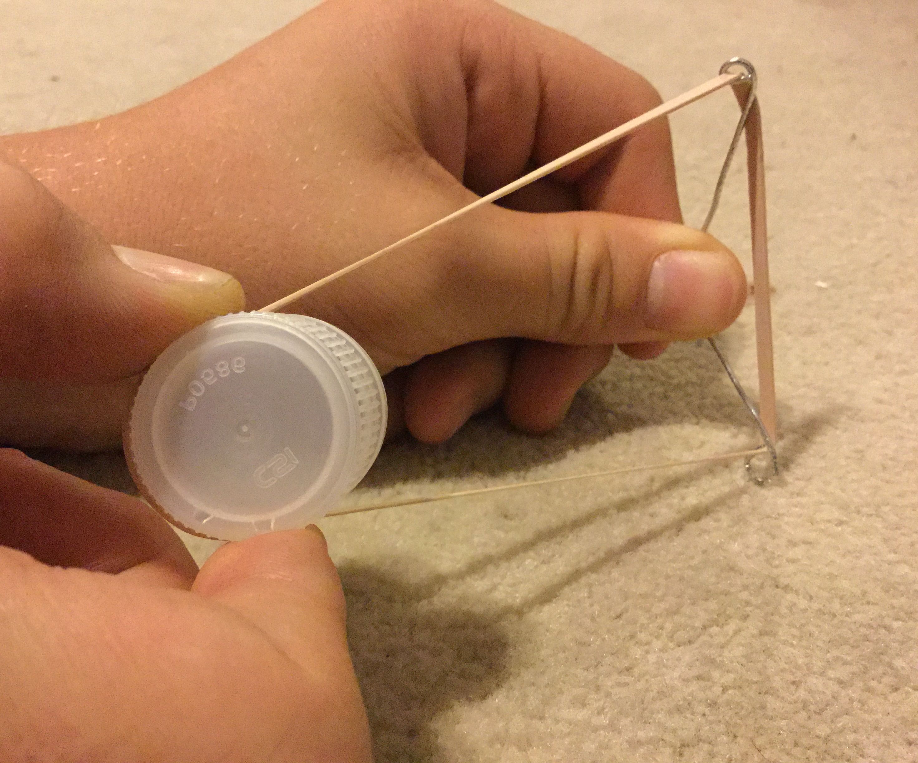 Mini paperclip sling-shot