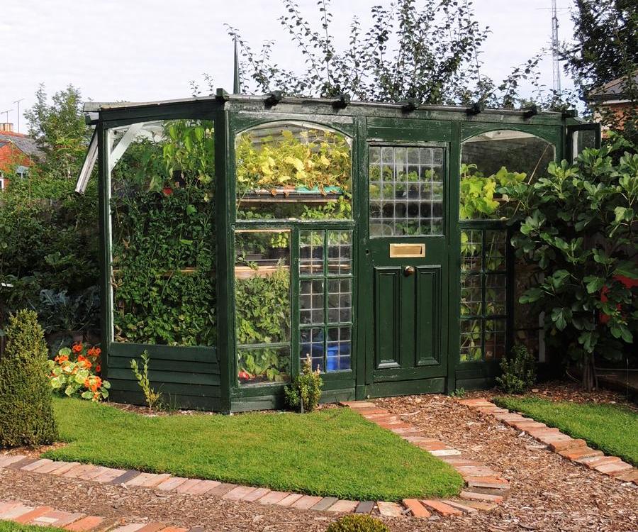 How to Build a Beautiful Boutique Greenhouse Cheaply From Reclaimed Materials