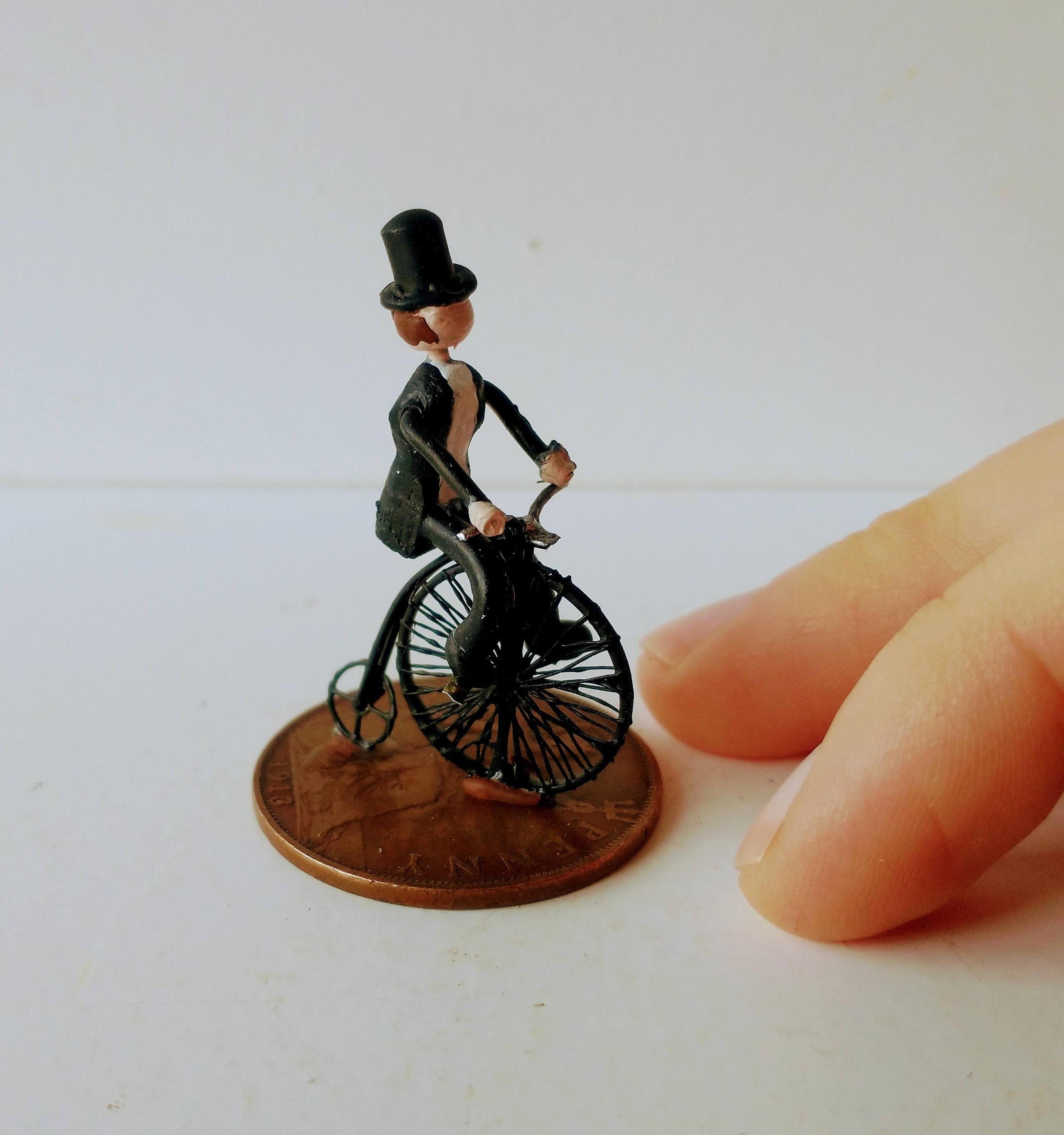 Tiny Penny Farthing Bicycle Made From Pocket Watch Gears - Small Enough to Put on an Old Penny