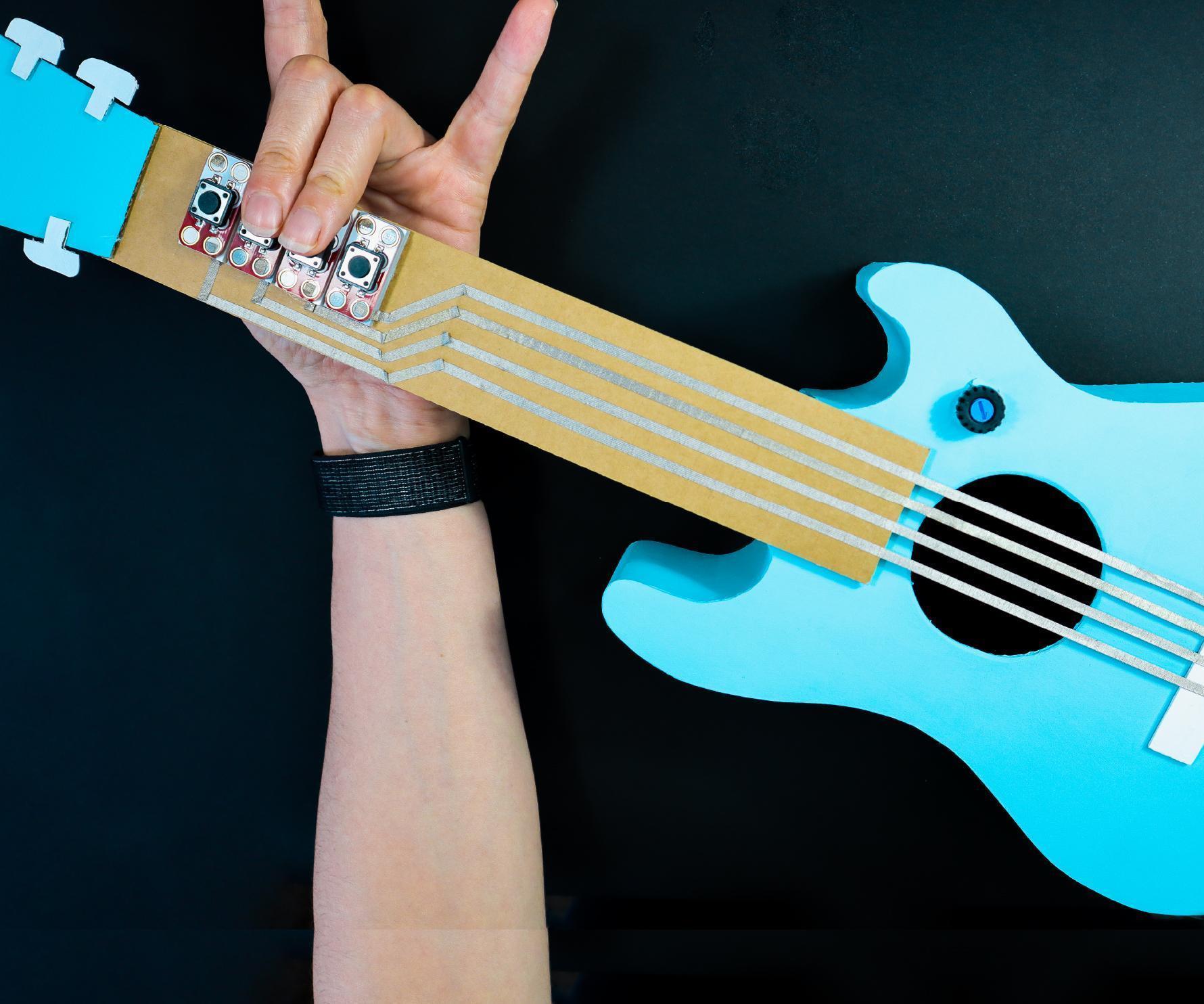 The "Instant Star Guitar": a Cardboard 4-Chord Electric Guitar